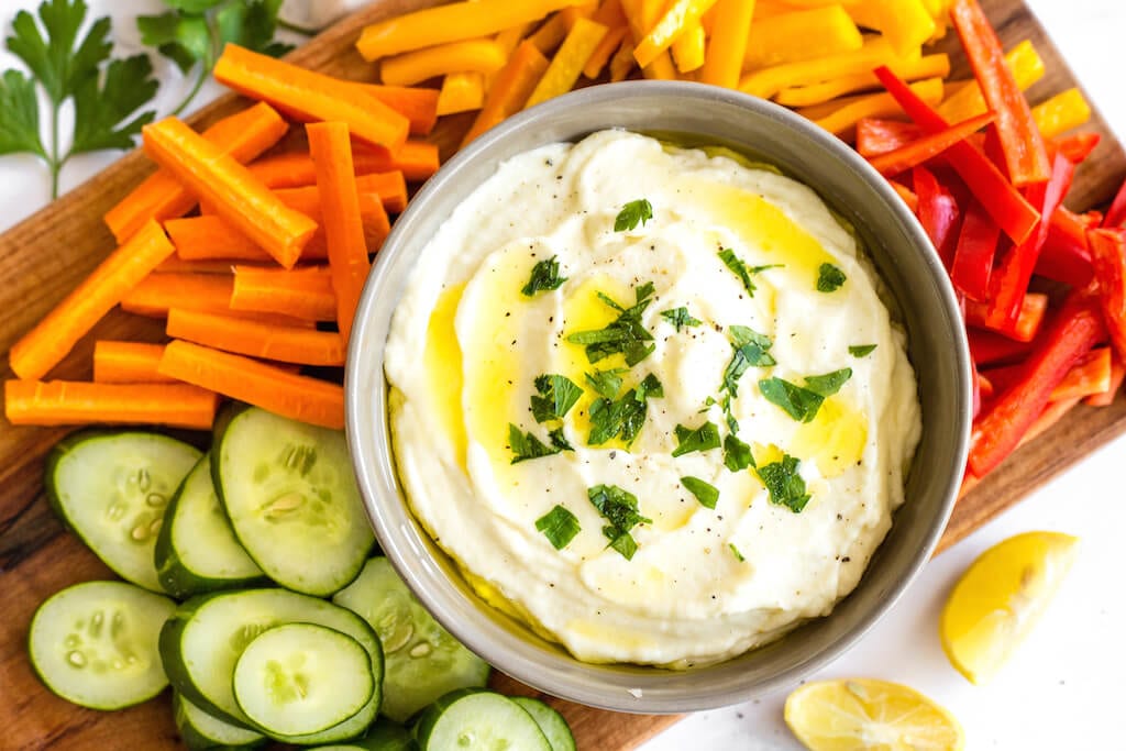 This light and airy egg-free Lebanese garlic sauce (or toum) can be slathered on with meat, added to pasta or vegetables for garlic flavor, or simply used as a delicious dip. 