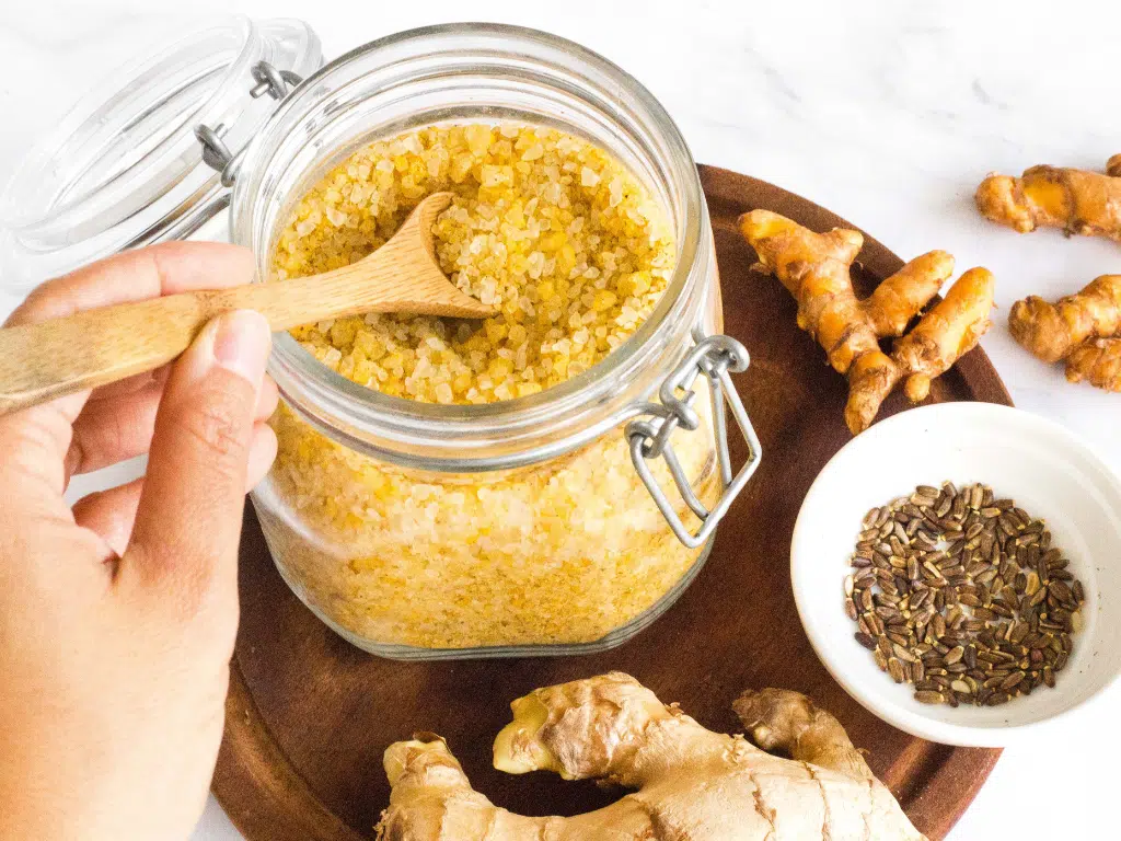 Jar of golden salt on table