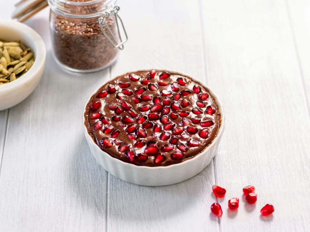 Decadent Single Serve Pomegranate Chocolate Tart on White Table